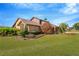 Brick house with large yard and mature landscaping at 6151 Silver Oaks Dr, Zephyrhills, FL 33542