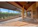 Brick-paved screened porch with ceiling fans and open view at 6151 Silver Oaks Dr, Zephyrhills, FL 33542