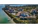 Aerial view of waterfront community with pool and private dock at 6218 Palma Del Mar S Blvd # 208, St Petersburg, FL 33715