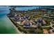 Aerial view of waterfront community with pool and private dock at 6218 Palma Del Mar S Blvd # 208, St Petersburg, FL 33715