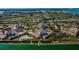 Aerial view of waterfront community with pool and private dock at 6218 Palma Del Mar S Blvd # 208, St Petersburg, FL 33715