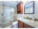 Updated bathroom with granite vanity and walk-in shower at 6218 Palma Del Mar S Blvd # 208, St Petersburg, FL 33715