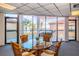 Common room with water views, seating area, and glass-top table at 6218 Palma Del Mar S Blvd # 208, St Petersburg, FL 33715