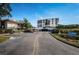 Condo building with parking and lush landscaping at 6218 Palma Del Mar S Blvd # 208, St Petersburg, FL 33715