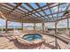 Hot tub area with pergola and waterfront view at 6218 Palma Del Mar S Blvd # 208, St Petersburg, FL 33715