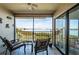 Serene lanai with water view and seating at 6218 Palma Del Mar S Blvd # 208, St Petersburg, FL 33715