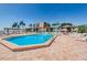 Community pool with surrounding lounge chairs at 6218 Palma Del Mar S Blvd # 208, St Petersburg, FL 33715