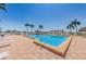 Relaxing community pool area with water view at 6218 Palma Del Mar S Blvd # 208, St Petersburg, FL 33715