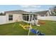 Backyard with swingset and playset at 6325 Chapel Pines Blvd, Wesley Chapel, FL 33545