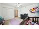 bedroom with crib, dresser, and closet at 6325 Chapel Pines Blvd, Wesley Chapel, FL 33545