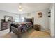 Bedroom with a wooden bed frame, dresser and carpet flooring at 6325 Chapel Pines Blvd, Wesley Chapel, FL 33545