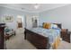 Bright bedroom with a king-size bed and ensuite bathroom access at 7418 S Morton St, Tampa, FL 33616