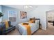 Charming bedroom with a queen-size bed and access to another room at 7418 S Morton St, Tampa, FL 33616