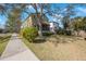 Two-story house with a screened porch and yard at 7418 S Morton St, Tampa, FL 33616