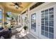 Relaxing screened porch with seating and potted plants at 7418 S Morton St, Tampa, FL 33616