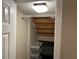 Unfinished basement with shelving and stairs at 8313 Shallow Creek Ct, New Port Richey, FL 34653