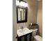 Stylish bathroom with updated vanity and mirror at 8313 Shallow Creek Ct, New Port Richey, FL 34653