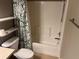 Clean bathroom with shower/tub combo and toilet at 8313 Shallow Creek Ct, New Port Richey, FL 34653