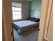 Bedroom with window, neutral walls, and carpeted floors at 8313 Shallow Creek Ct, New Port Richey, FL 34653