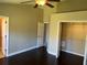 Spacious bedroom with dark hardwood floors and large walk-in closet at 8313 Shallow Creek Ct, New Port Richey, FL 34653