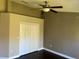 Bedroom with dark hardwood floors and ceiling fan at 8313 Shallow Creek Ct, New Port Richey, FL 34653