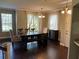 Bright dining room with hardwood floors and an elegant chandelier at 8313 Shallow Creek Ct, New Port Richey, FL 34653