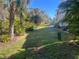 Landscaped area with lush greenery, showcasing the natural surroundings at 8313 Shallow Creek Ct, New Port Richey, FL 34653