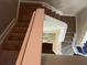 Indoor stairway with carpeted steps and neutral-toned walls at 8313 Shallow Creek Ct, New Port Richey, FL 34653