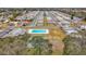 Aerial view of community with pool, shuffleboard, and homes at 8330 Vendome N Blvd # X, Pinellas Park, FL 33781