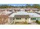 Aerial view of tan house with a shingled roof at 8330 Vendome N Blvd # X, Pinellas Park, FL 33781