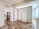 Light and bright hallway with wood-look laminate flooring at 8330 Vendome N Blvd, Pinellas Park, FL 33781