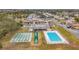 Community pool with shuffleboard and surrounding homes at 8330 Vendome N Blvd, Pinellas Park, FL 33781