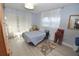 Bright bedroom with wood-look floors, and plenty of closet space at 948 Virginia St # 110, Dunedin, FL 34698