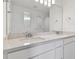 Double vanity bathroom with white cabinets and quartz countertop at 9801 Crescent Moon Dr, Riverview, FL 33578