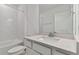 Clean bathroom with white subway tile and quartz countertop vanity at 9801 Crescent Moon Dr, Riverview, FL 33578