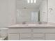 Bathroom with double vanity and quartz countertop at 9801 Crescent Moon Dr, Riverview, FL 33578