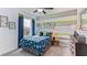 Dinosaur-themed bedroom with fun wall decor at 10559 Dusty Boot Rd, Land O Lakes, FL 34638