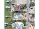 Birds-eye view of two waterfront homes with pools and docks at 11325 9Th E St, Treasure Island, FL 33706