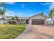 Updated home exterior with a new garage door and landscaping at 1300 51St Ne Ave, St Petersburg, FL 33703