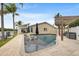 L-shaped pool with patio and water view at 1300 51St Ne Ave, St Petersburg, FL 33703