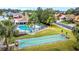 Aerial view of community pool, shuffleboard, and surrounding homes at 13108 Dobree Pl, Riverview, FL 33579
