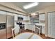 Charming kitchen featuring white cabinets and stainless steel appliances at 13108 Dobree Pl, Riverview, FL 33579