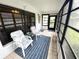 Enclosed patio featuring comfortable seating and a screened window at 13108 Dobree Pl, Riverview, FL 33579