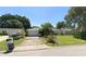 Ranch-style home with a spacious yard and attached garage at 1349 Woodbine St, Clearwater, FL 33755