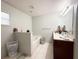 Bathroom with a bathtub, shower, and double vanity at 1447 Coble Rd, Spring Hill, FL 34608