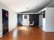 Dining room features a modern barn door and hardwood floors at 1447 Coble Rd, Spring Hill, FL 34608