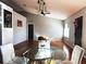Bright dining room with glass table and hardwood floors at 1447 Coble Rd, Spring Hill, FL 34608