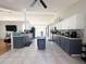 Spacious kitchen with gray cabinets, granite counters, and island at 1447 Coble Rd, Spring Hill, FL 34608