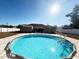 Backyard with a round above ground pool at 1447 Coble Rd, Spring Hill, FL 34608