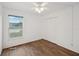 Bright bedroom with hardwood floors and a window at 1799 N Highland Ave # 136, Clearwater, FL 33755